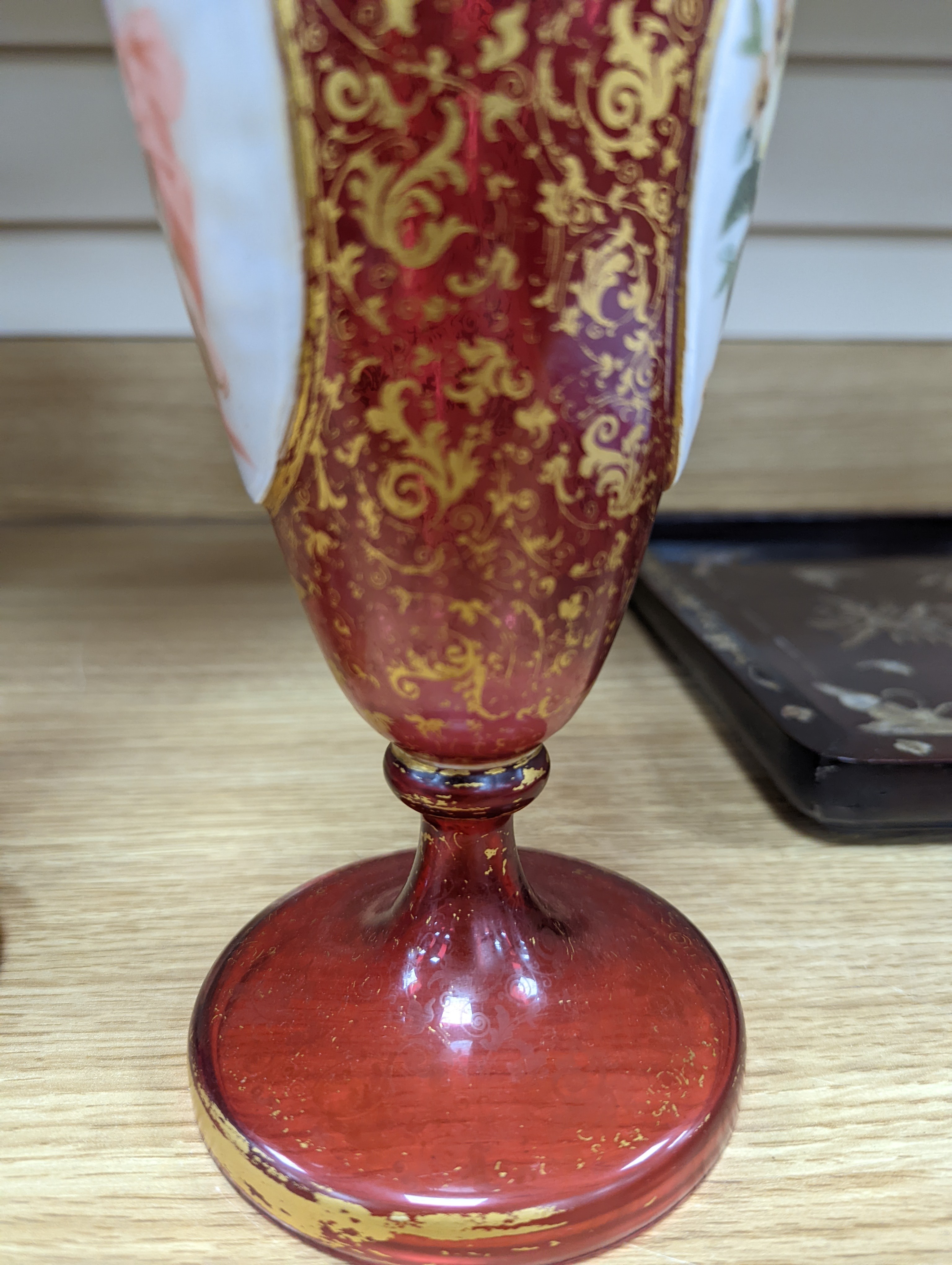 A pair of 19th century Bohemian enamelled and overlaid ruby glass vases 36cm